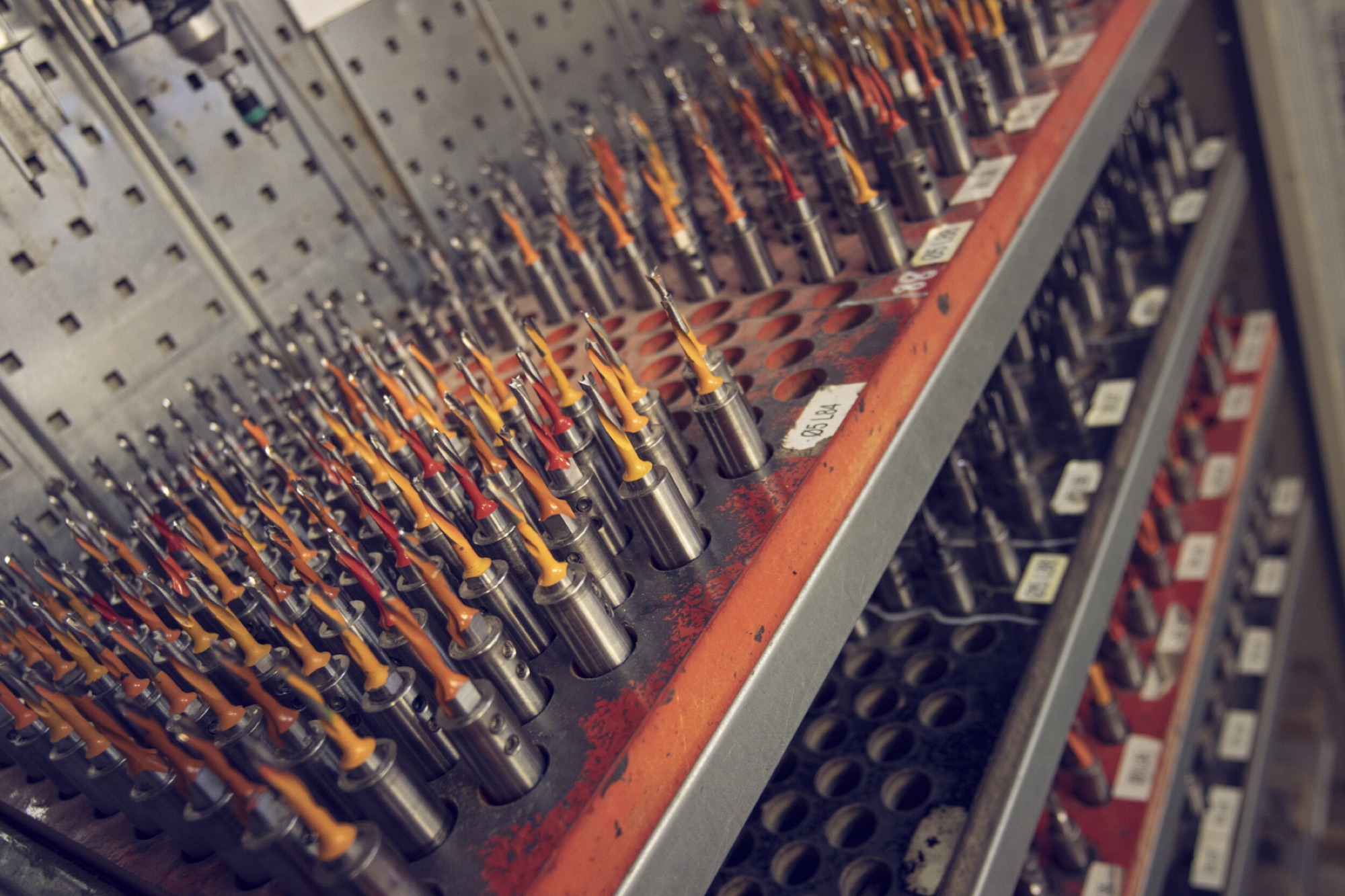 Racks of precision drill bits and tooling held to fine tolerance